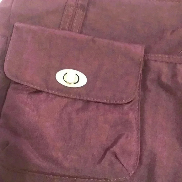 Magellan’s purple nylon shoulder bag. - Picture 2 of 12